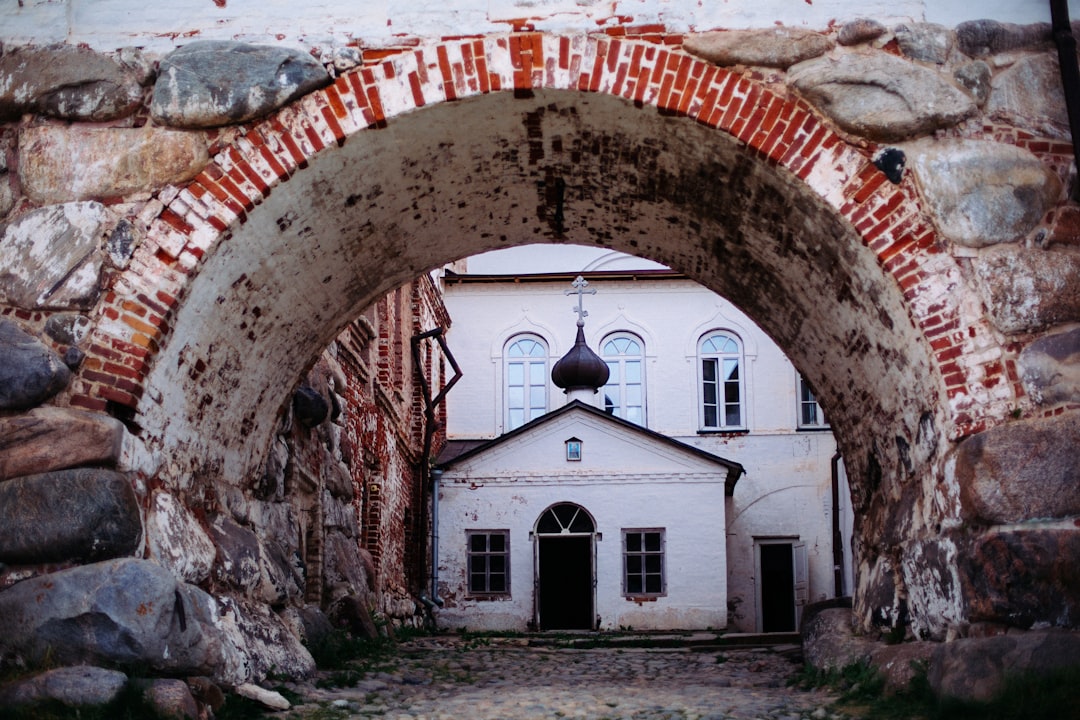 Sfântul Ioan Botezătorul monastery exterior faded frescoes ancient stone wall