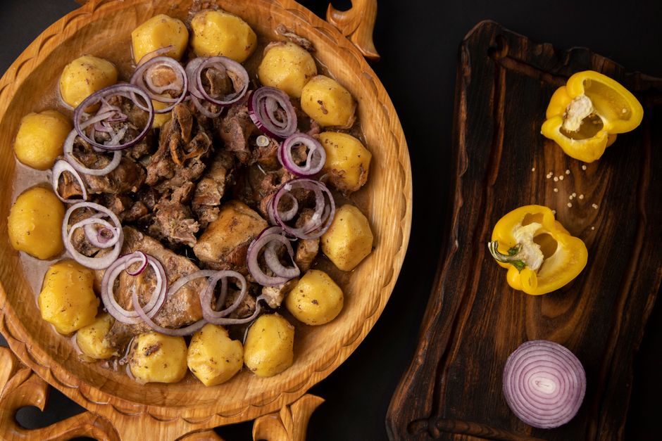 Romanian mămăligă and sarmale dish on wooden plate rustic setting
