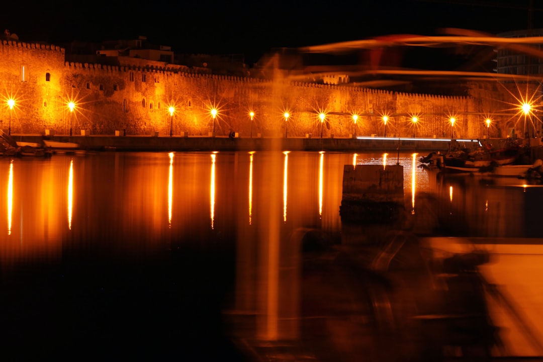 Kotor port night boats lights reflection water