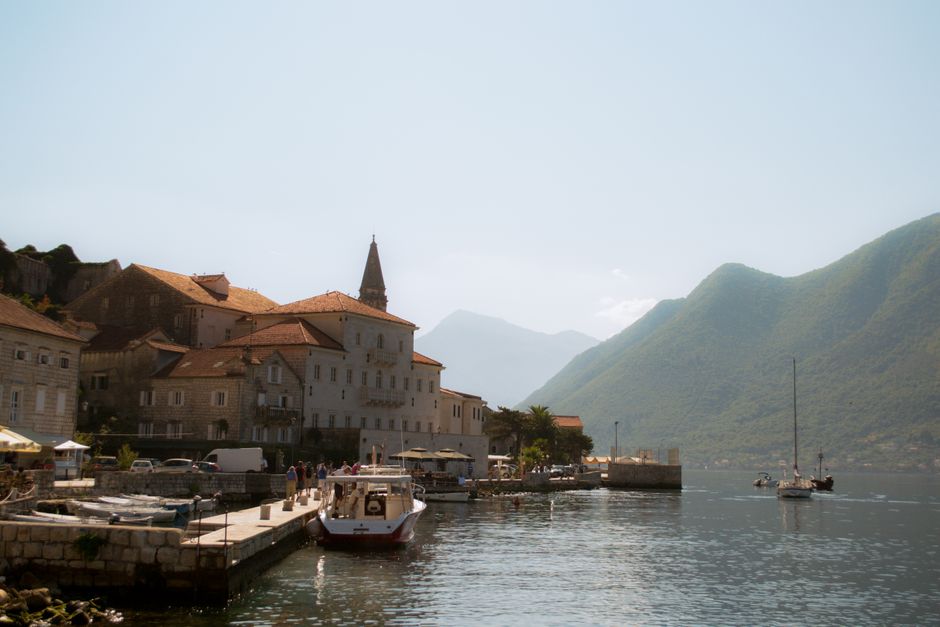 Perast waterfront Montenegro cafes evening illuminated